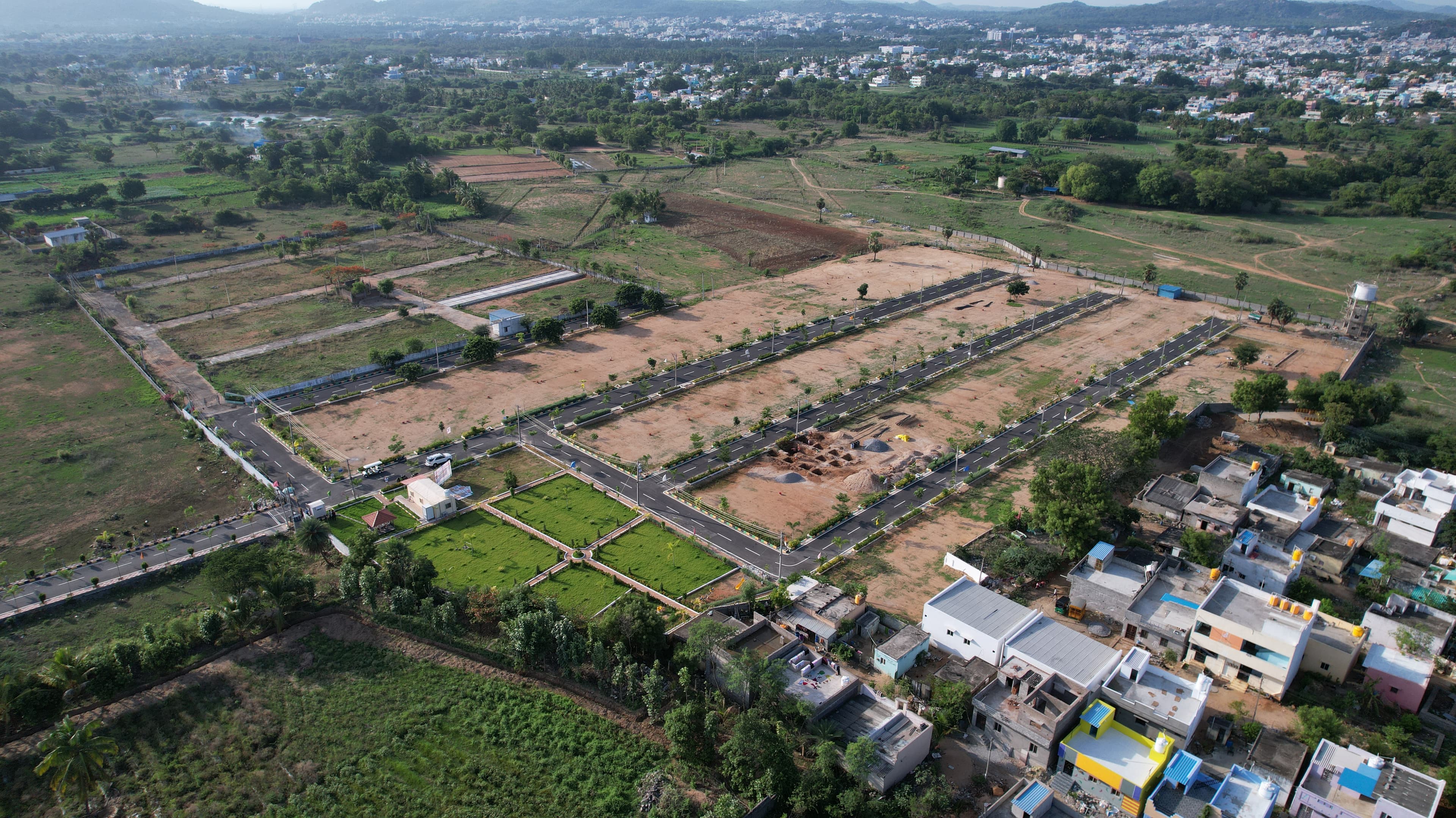 Modern plotted land development with neat layout and paved roads