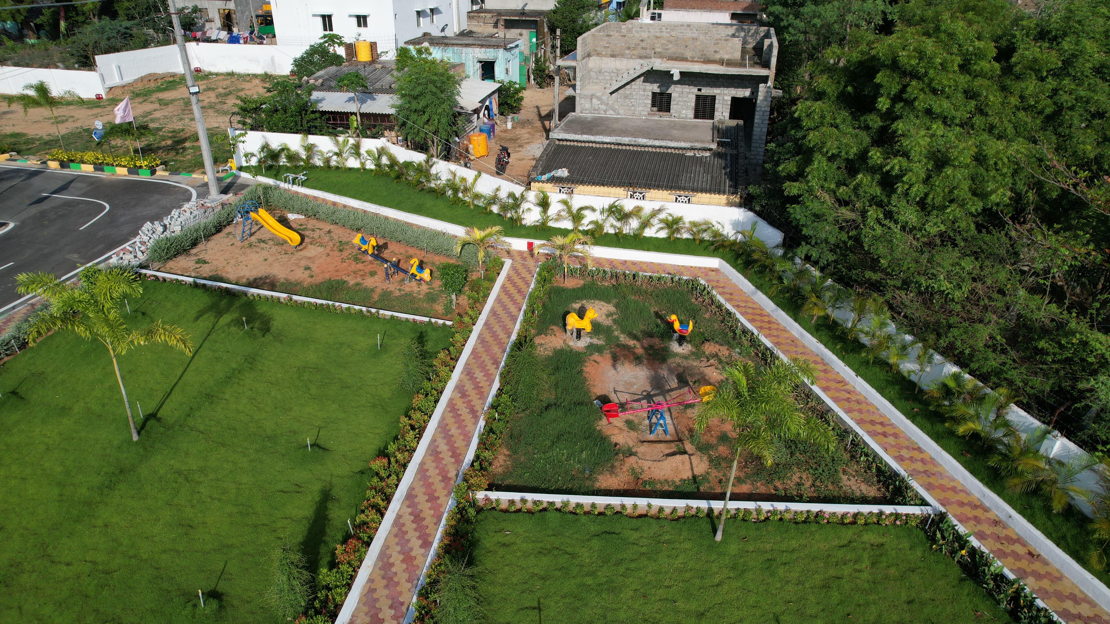 South Indian family visiting a layout plot, inspecting boundary stone with happiness